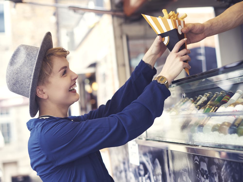 customer-reaching-food-from-vendor