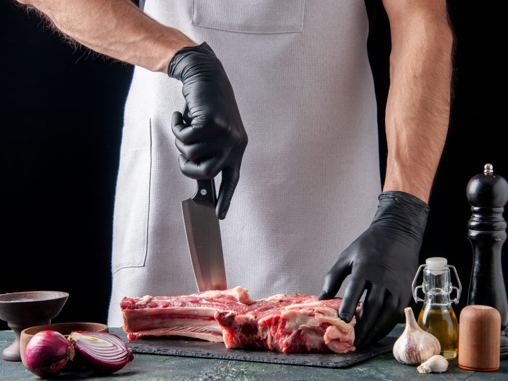 chef-cutting-meat-photo